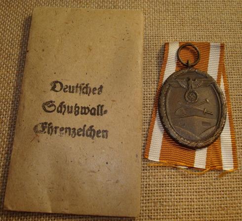 WWII GERMAN WEST WALL MEDAL AND ENVELOPE